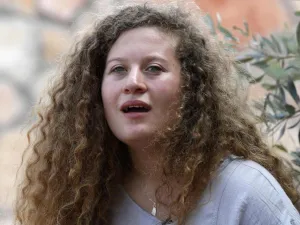 Palestinian activist and campaigner Ahed Tamimi, 17, listens during an interview with Agence France-Presse, in the West Bank village of Nabi Saleh on July 30, 2018. (AFP)
