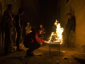 Palestinians gather around a fire during a power cut in the Al-Shati refugee camp in Gaza City, on January 4, 2017. (AFP/Mahmud Hams) Palestinians gather around a fire during a power cut in the Al-Shati refugee camp in Gaza City, on January 4, 2017. (AFP/Mahmud Hams)