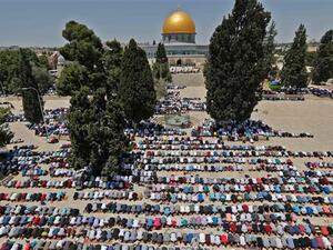 Palestinian worshipers pray near the Dome of the Rock mosque in Al-Aqsa Mosque compound in Jerusalem al-Quds. (AFP/ File)