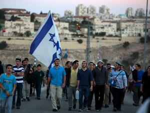 Israelis march from the Jewish settlement of Maale Adumim to the controversial West Bank area known as E1 on February 13, 2014. (AFP/Menahem Kahana)