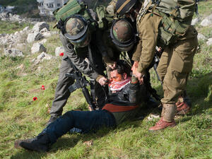 Israeli soldiers pepper spray a Palestinian as they crackdown on protest over land belonging to the West Bank. (Shutterstock/ File Photo)