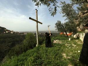 Greek Orthodox monks work in a garden at the monastery of Our Lady of Hamatoura in northern Lebanon on March 08, 2016. (AFP/ File Photo)