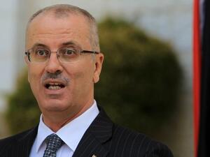 Palestinian Authority Prime Minister Hamdallah speaks during a press conference following the first cabinet meeting of the new Palestinian unity government in the West Bank city of Ramallah. (AFP/ File Photo) Palestinian Authority Prime Minister Hamdallah speaks during a press conference following the first cabinet meeting of the new Palestinian unity government in the West Bank city of Ramallah. (AFP/ File Photo)