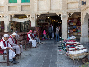 Porters with their barrows await work outside part of the imposing Souq Waqif tourist attraction in Doha. (Shutterstock/Peter Cowan)