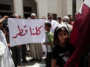 Palestinians attend a rally in support of Qatar, at the Qatari-funded housing project in the southern Gaza Strip city of Khan Yunis on June 9, 2017. (Said Khatib/AFP)