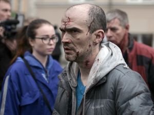 An injured man leaves the scene of an explosion in St Petersburg.  (AFP)