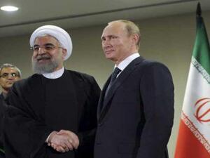 الرئيس الروسي فلاديمير بوتين ونظيره الإيراني حسن روحاني
