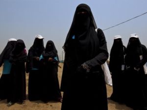 Shrouded in black, are these women the last of an ending era? - Shown for illustrative purposes.