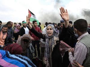 Palestinian demonstrators near the border with Israel (AFP)