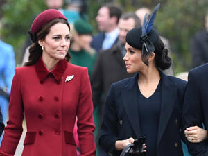 Britain's Catherine, Duchess of Cambridge (L) talks to Meghan, Duchess of Sussex as they arrive for the Royal Family's traditional Christmas Day service at St Mary Magdalene Church. (AFP/File)