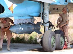 Russian technicians check a bomber at an airbase in Syria. (AFP/Alexander Kots)