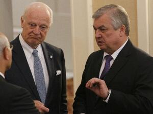 Russian mediator Alexander Lavrentiev (R) reportedly held extensive discussions on the situation in Syria with Ali Shamkhani, secretary of Iran's Supreme Council on National Security, and other officials (AFP/Stanislav FILIPPOV)