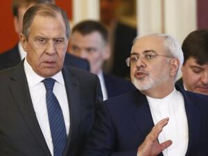 Russian Foreign Minister Sergei Lavrov, left, and Iranian Foreign Minister Mohammad Javad Zarif arrive for a joint press conference with the Russian and Iranian presidents at the Kremlin in Moscow, March 28, 2017. (AFP/ Sergei Karpukhin) 
