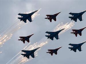 Russian Su-27 jet fighters and MIG 29 jet fighters fly above the Red Square. (AFP/ File)