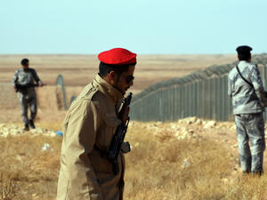 Members of the Saudi border guards patrol the fence on the Iraqi border. (AFP/ File Photo)