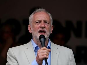 UK opposition Labour party leader Jeremy Corbyn speaks to protesters in Parliament square during an anti-austerity demonstration on July 1, 2017 in London. (Photo by AFP)