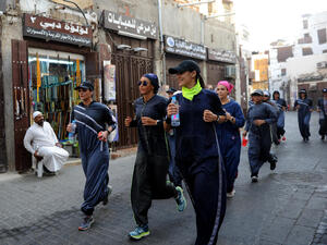 Saudi women jog in the streets of Jeddah in March. The government is encouraging greater participation of women in sports. (AFP/ File Photo)