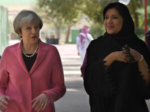British Prime Minister Theresa May walks alongside Princess Reema Bint-Bandar al-Saud. (AFP) 
