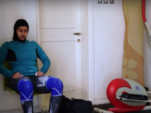 Amna al Hadad during a break in training (Youtube)