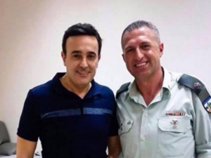 Saber Rebai with officer Hadi. (Twitter)