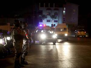 Security forces stand guard outside the Israeli embassy in Amman, Jordan (AFP/File Photo)	 Security forces stand guard outside the Israeli embassy in Amman, Jordan (AFP/File Photo)