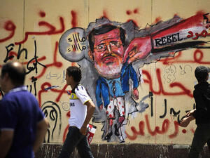 Egyptian graffiti in Cairo depicting the ousting of Morsi. (AFP/File)