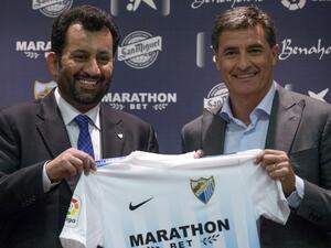 عبد الله آل ثاني (يسار)