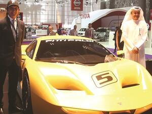 Emerson Fittipaldi (left) and a dignitary from NBK unveil the Supercar Fittipaldi EF7 Vision Gran Turismo by Pininfarina’ at QMS 2017. (Photo: Jayan Orma)