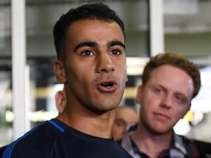 Footballer Hakeem al-Araibi (L) speaks to the media upon his arrival at the airport in Melbourne on February 12, 2019. Refugee footballer Hakeem al-Araibi made a triumphant return to Australia on February 12, ending a two month ordeal that saw him jailed in Thailand and threatened with forced return to his native Bahrain.
WILLIAM WEST / AFP