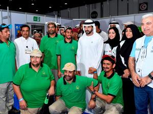 Sheikh Hamdan bin Mohammed poses for a photo with members of the Zayed Higher Organization for Humanitarian Care at the Special Olympics Mena Games. (Photo: Emirates News Agency)