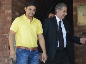 Suspended Pakistani cricketer Khalid Latif (L) and his lawyer leave the High Court building in Lahore on April 14, 2017.
ARIF ALI / AFP