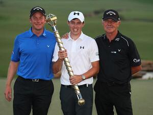 Matt Fitzpatrick poses with the trophy and Coaches Mike Walker (L) and Pete Cowen (R) following his victory during day four of the DP World Tour Championship at Jumeirah Golf Estates on November