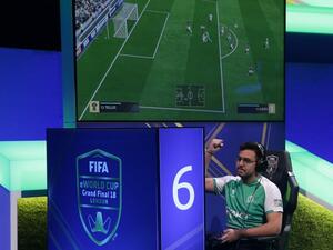 Player Mossad Aldossary competes in the group stages of the FIFA eWorld Cup Grand Final, at the O2 in London on August 2, 2018. The FIFA eWorld Cup Grand Final 2018 will see 32 finalists battle it out for the main prize – the title of FIFA eWorld Cup champion, and pocket USD 250,000 in prize money.
Daniel LEAL-OLIVAS / AFP
