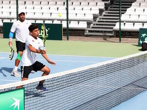 Omani debutant Muneer Al Rawahi hits a return as teammate Mohammed Al Nabhani looks on during their doubles match against Kyrgyzstan's Evgeniy Babak and Georgy Kotlyarevsky on Wednesday. Photo - Supplied