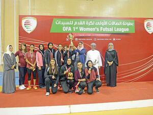 The victorious Al Ittifaq Club players receive the trophy from H H Mona bint Fahad al Said at the awards ceremony held at the Sultan Qaboos Sports Complex on Tuesday (Photo: Muscat Daily)