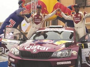 Qatar’s Nasser Saleh al-Attiyah (R) and co-driver Matthieu Baumel celebrate their Kuwait Rally win yesterday (source: Gulf Times)