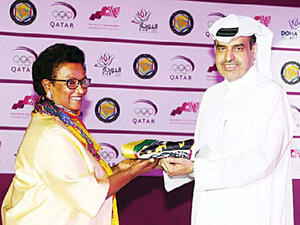 Sheikha Naeema Al-Ahmad Al-Sabah receives the flag (Photo: Arab Times)