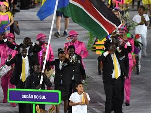 South Sudan's flagbearer Guor Marial leads his delegation during the opening ceremony of the Rio 2016 Olympic Games at the Maracana stadium in Rio de Janeiro on August 5, 2016.
PEDRO UGARTE / AFP