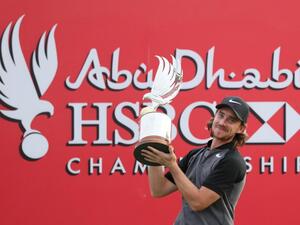 Tommy Fleetwood of England poses with the winner's trophy during the final day of the Abu Dhabi Golf Championship in the capital of the United Arab Emirates on January 22, 2017.
KARIM SAHIB / AFP
