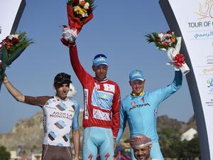 Italian Vincenzo Nibali (C) of Astana Pro Team, French Romain Bardet of AG2R La Mondiale (L) and Norwegian Edvald Baosson Hagen (R) of Dimension Data celebrate on the podium after winning the sixth and final stage of the seventh cycling Tour of Oman between Muscat and Mutrah Corniche, on February 21, 2016. Vincenzo Nibali won the Tour of Oman for the Astana team after Norwegian Alexander Kristoff took the sixth and final stage in a sprint finish.