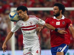 Zamalek's Omar Gaber vies with Al-Ahly's Hossam Ghaly (R) during the Egypt super cup football match between Al-Ahly SC and Zamalek Egyptian football clubs, October 15, 2015 at Sheik Hazza Bin Zayed stadium in Al-Ain, UAE. AFP PHOTO / MARWAN NAAMANI

MARWAN NAAMANI / AFP