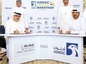 Major General Mohammad Khalfan Al Romaithi, Chairman of General Authority for Sports, Aref Hamad Al Awani, Secretary General of the Abu Dhabi Sports Council, Omar Suwaina Al Suwaidi, Executive Office Director at ADNOC and Sultan Bin Ahmad Al Jaber during the partnership signing ceremony for the ADNOC Abu Dhabi Marathon.