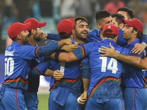 Afghan cricketer Rashid Khan (C), captain Asghar Afghan (R) celebrates with teammate after Match tied during the one day international (ODI) Asia Cup cricket match between Afghanistan and India at the Dubai International Cricket Stadium in Dubai on September 25, 2018.
ISHARA S. KODIKARA / AFP