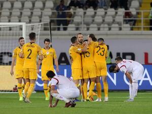 Australia celebrate their 3-2 win in the 2019 AFC Asian Cup group B football match between Australia and Syria at the Khalifa bin Zayed stadium in al-Ain on January 15, 2019.
Karim Sahib / AFP