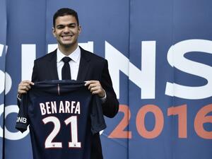 Paris Saint-Germain's new recruit French attacking midfielder Hatem Ben Arfa poses with his jersey at the Parc des Princes stadium in Paris on July 4, 2016.
PHILIPPE LOPEZ / AFP