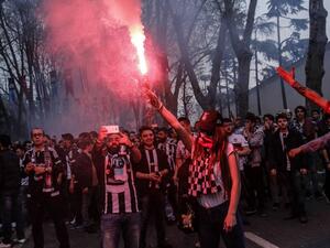 Besiktas supporters cheer their team before the Turkish Spor Toto Super league football match between Besiktas and Bursaspor at vodafone arena stadium on April 11, 2016 in Istanbul. Besiktas football team plays its first game at the new vodafone Arena stadium after its inauguration on April 10.
YASIN AKGUL / AFP