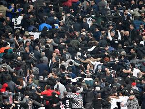Besiktas supporters react during the second leg of the last 16 UEFA Champions League football match between Besiktas and Bayern Munich at Besiktas Park in Istanbul on March 14, 2018.
Bulent Kilic / AFP