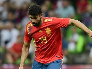  Spain have moved level on points with Portugal at the summit of Group B after edging past a spirited Iran side at the Kazan Arena. 