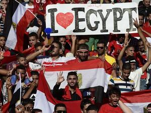 Egyptian fans cheer for their national team before the FIFA World Cup 2018 qualification football match between against Uganda at the Borg al-Arab Stadium near Alexandria on September 5, 2017.
KHALED DESOUKI / AFP
