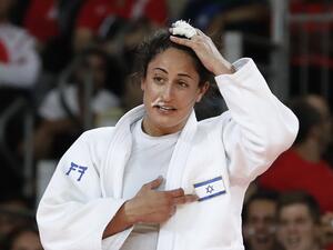 Israel's Yarden Gerbi celebrates after defeating Japan's Miku Tashiro during their women's -63kg judo contest bronze medal A match of the Rio 2016 Olympic Games in Rio de Janeiro on August 9, 2016.
Jack GUEZ / AFP